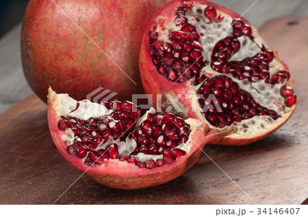 Pomegranate on a timber board 34146407
