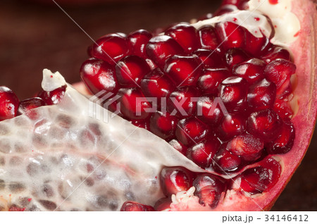 Pomegranate on a timber board 34146412