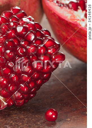 Pomegranate on a timber board Pomegranate on a timber board 34146416
