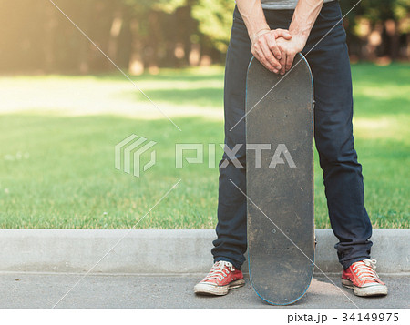 Skateboarding lifestyle of young hipster man 34149975