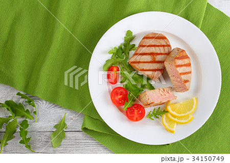 grilled tuna steaks cut in pieces 34150749