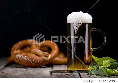 Glass of beer and pretzel Glass of beer and pretzel 34151099