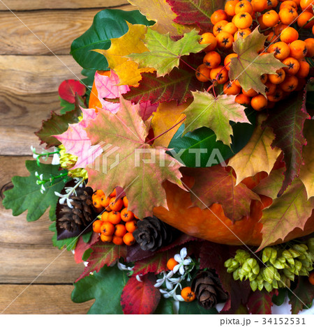 Fall decor with rowan and autumn leaves 34152531