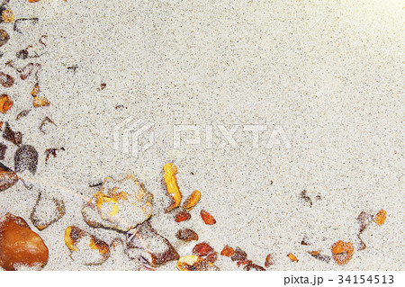 Amber. the pieces of amber in the sand on the Amber. the pieces of amber in the sand on the 34154513