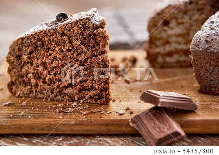 Delicious chocolate cake in white plate on wooden 34157300