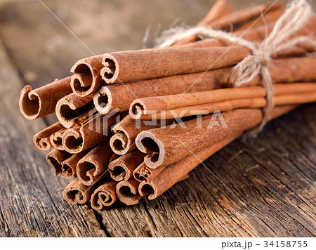 Cinnamon on table wooden background. Cinnamon on table wooden background. 34158755
