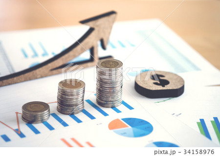 financial banking stock spreadsheet with stack of coin and backg financial banking stock spreadsheet with stack of coin and backg 34158976