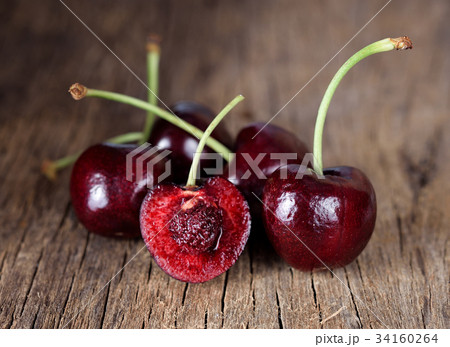 Fresh cherry on wooden background. Fresh cherry on wooden background. 34160264