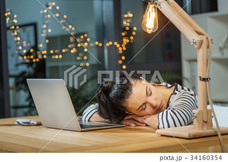 Hard working tired woman sleeping at work Hard working tired woman sleeping at work 34160354
