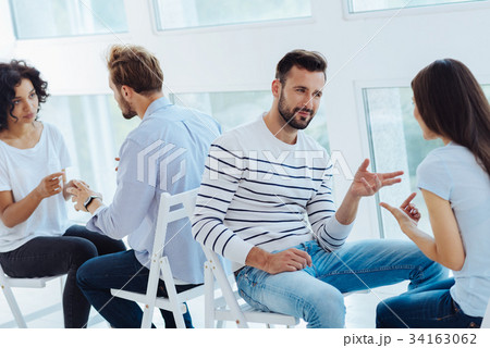 Handsome nice man talking to his partner 34163062