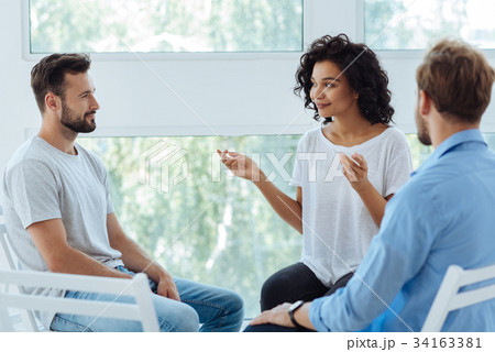 Professional nice therapist looking at her Professional nice therapist looking at her 34163381
