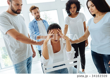 Cheerless depressed woman having a headache Cheerless depressed woman having a headache 34163509