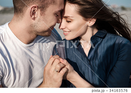 Young Couple Enjoying Beach Holiday 34163576