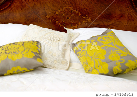 Nice pillows on a magnificent bed 34163913