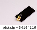 cell phone security - lock and phone on white 34164116