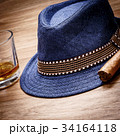 blue hat with cigar and expensive drink whisky rum 34164118