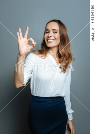 Happy nice woman showing OK gesture 34164266