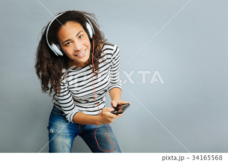 Attentive international girl posing on camera Attentive international girl posing on camera 34165568