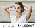 Beautiful girl in white summer dress 34166007
