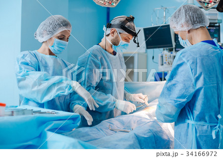 Attentive surgeon going difficult operation Attentive surgeon going difficult operation 34166972