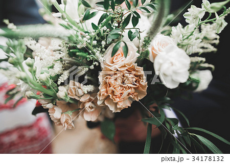 Beauty wedding bouquet with different flowers in 34178132