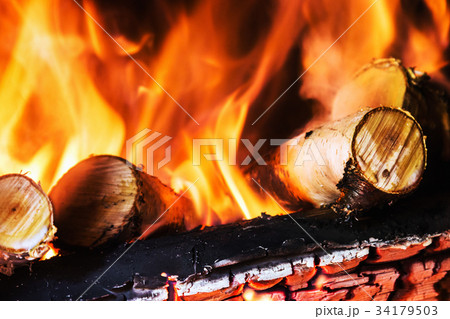 birch wood burning in the fireplace or bonfire  34179503