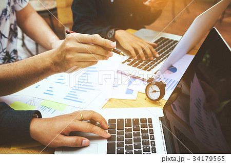 Online marketers entrepreneurs pointing to screen Online marketers entrepreneurs pointing to screen 34179565