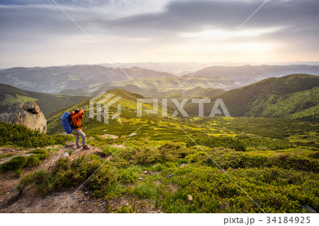Photographer in the mountains.Hiking man 34184925