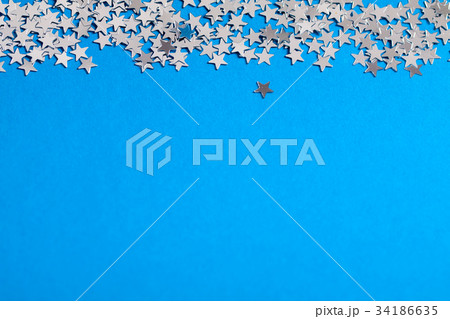 Frame of scatters little silver stars on blue. Frame of scatters little silver stars on blue. 34186635