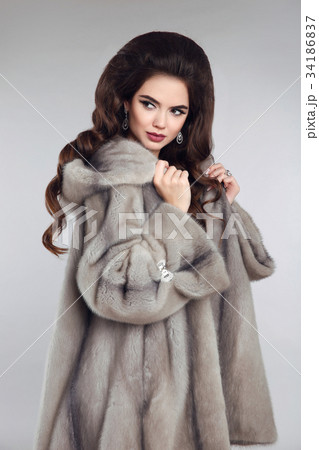 fashionable woman in mink fur coat. gorgeous 34186837