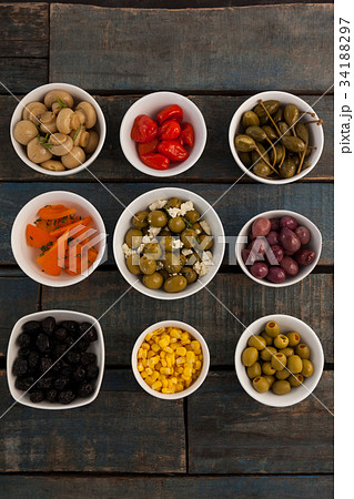 Close up of olives with oil in glass jar Close up of olives with oil in glass jar 34188297