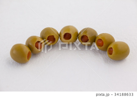 High angle view of olives in vodka martini High angle view of olives in vodka martini 34188633