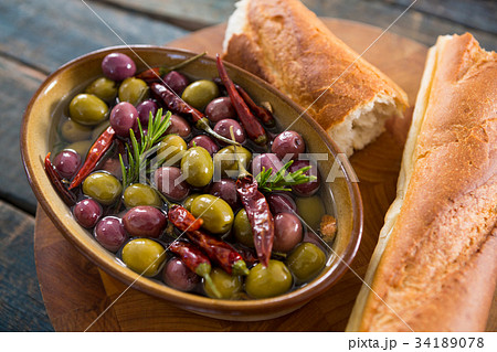 Dry olives in white bowl Dry olives in white bowl 34189078