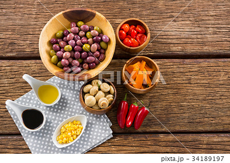 Pickled olives with ingredients and bread Pickled olives with ingredients and bread 34189197