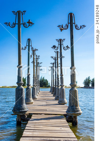 The wood pier and light posts decoration The wood pier and light posts decoration 34189248