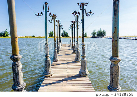 The light and wood pier posts decoration The light and wood pier posts decoration 34189259