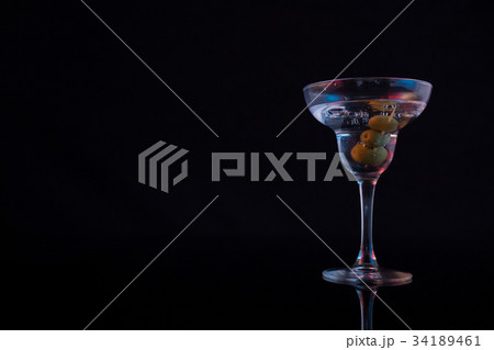 Marinated olives with herbs on wooden board 34189461