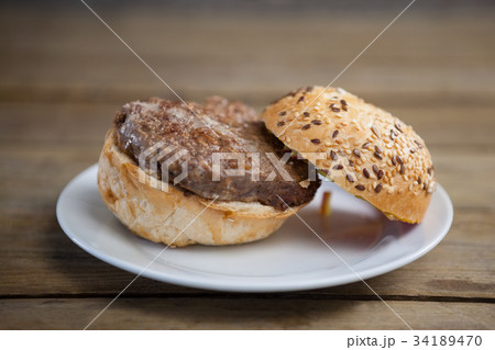 Hamburger, french fries and cold drink on table 34189470