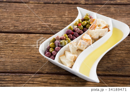 Close-up of pickled olives in bowls 34189471