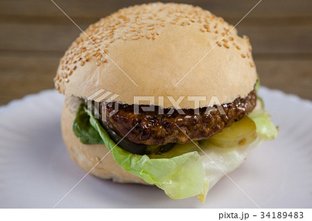 Hamburger, french fries and cold drink on table Hamburger, french fries and cold drink on table 34189483