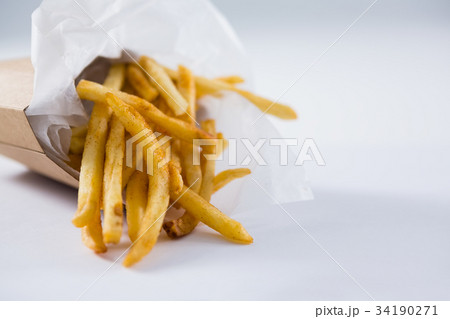 Hamburger served on napkin in plate 34190271