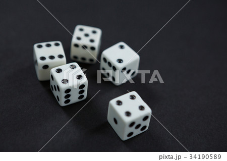 Various dice and playing cards on poker table Various dice and playing cards on poker table 34190589