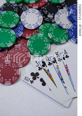 Playing cards arranged on poker table 34190691