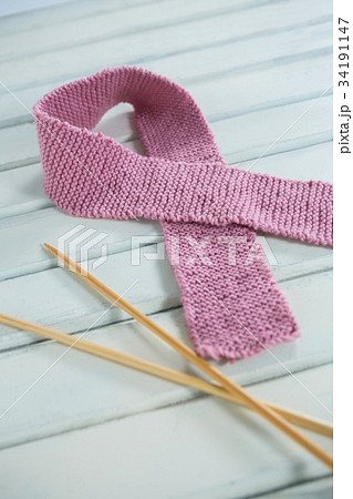 High angle view of pink Breast Cancer Awareness ribbon on gerbera flowers High angle view of pink Breast Cancer Awareness ribbon on gerbera flowers 34191147