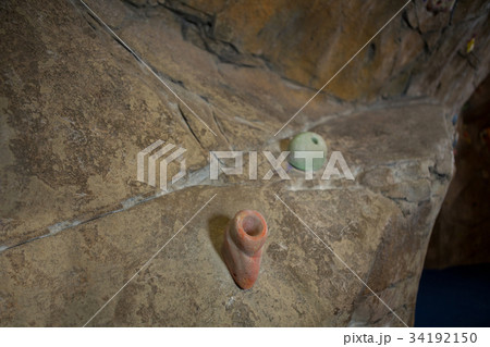 Overhead view of tennis ball with bandage on racket Overhead view of tennis ball with bandage on racket 34192150