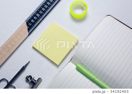 Keyboard, digital tablet, envelope and box on wooden table 34192403