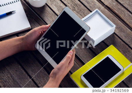 Keyboard, clipboard, apple and pen on wooden table Keyboard, clipboard, apple and pen on wooden table 34192569