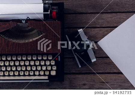 High angle view of coffee cup with paper and fountain pen High angle view of coffee cup with paper and fountain pen 34192735