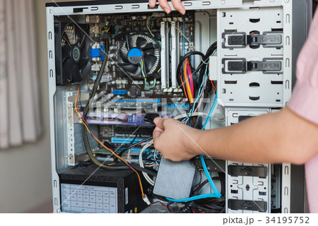 Young woman repairing computer 34195752