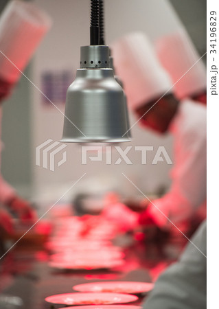 Chefs in luxury hotel restaurant kitchen cooking, Chefs in luxury hotel restaurant kitchen cooking, 34196829